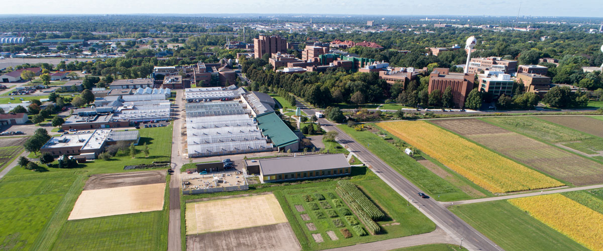 St Paul campus aerial view with greenhouses and fields in forefront.